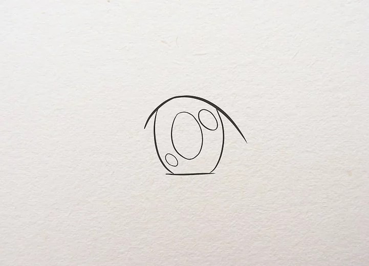 Vẽ một hình oval ở giữa hai hình oval và tô kín để làm con ngươi